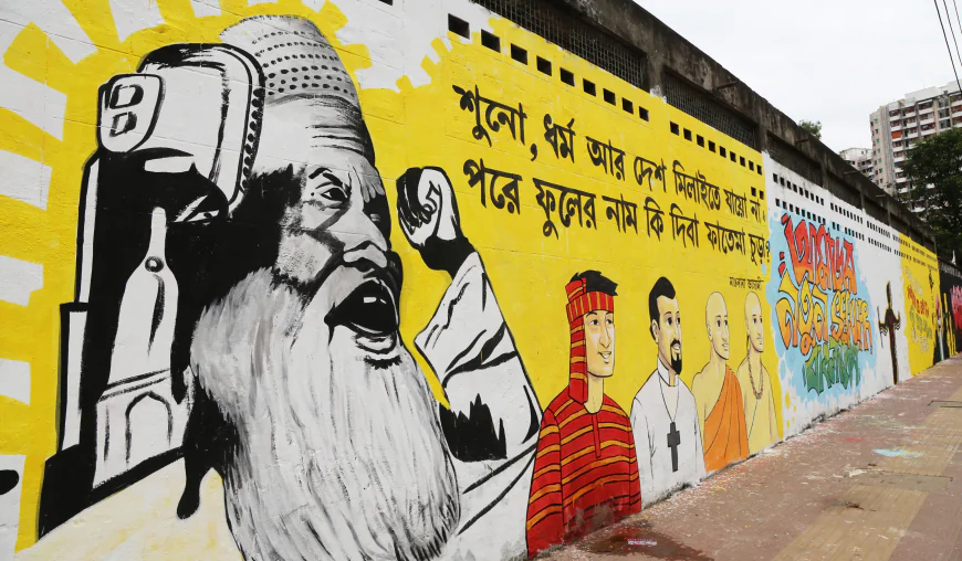 Unity in diversity painted loud — this mural calls for harmony beyond religion, identity, and nation, urging us to recognize our shared humanity. Photo © Salim Reza