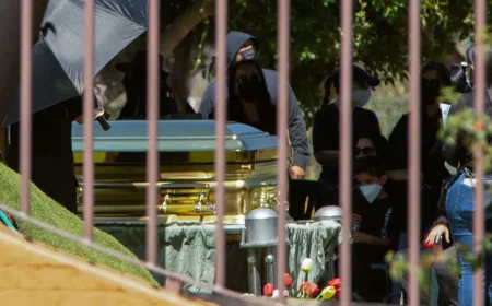 Flowers, music, and soldiers at funeral of drug lord