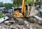 Expatriate son-in-law's house  Demolished with excavator
