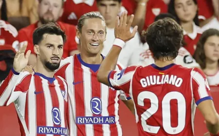 Atletico beat Sevilla to move top of La Liga