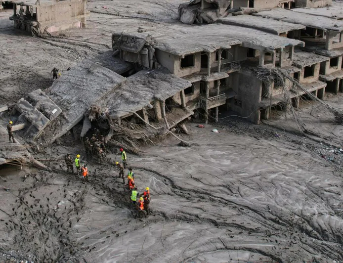 Rescuers dig into tunnel as Nepal, China flood missing toll nears 3,000