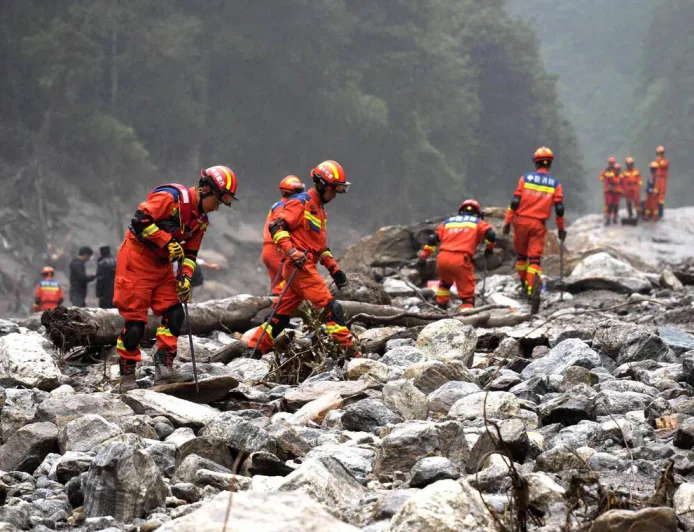 Nepal lays victims to rest as rescuers search for thousands still missing