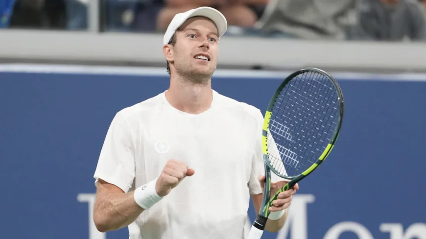 Van de Zandschulp saves match point to advance at US Open