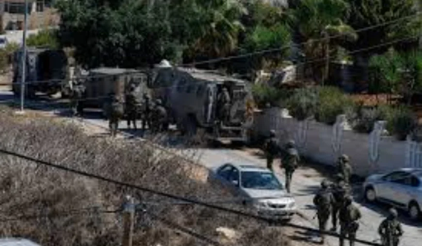 Israeli forces raid town of suspected Palestinian gunman, local authorities say