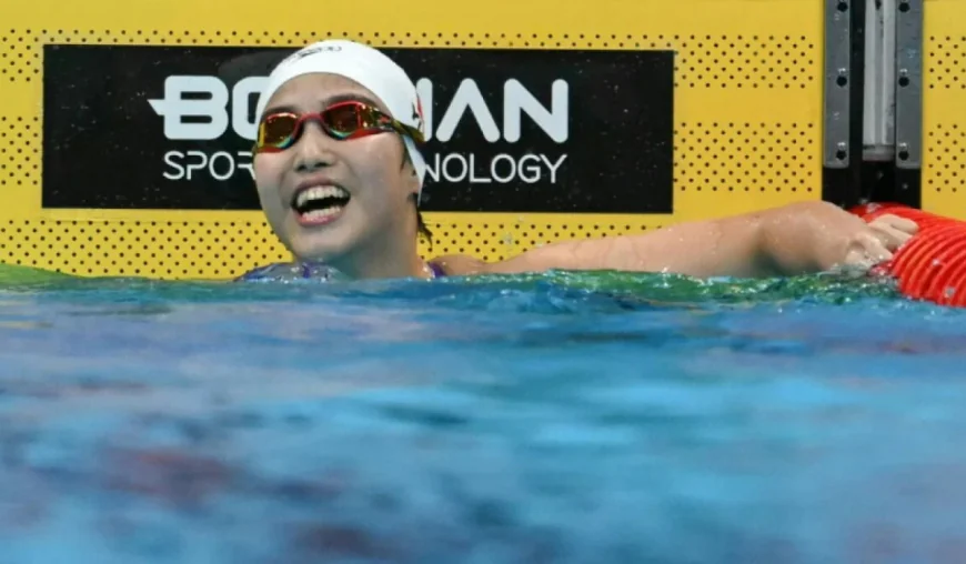 Swimming prodigy Yu, 13, says interviews are harder than racing