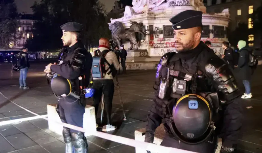 Paris bans protests in some areas as Macron criticises Trump